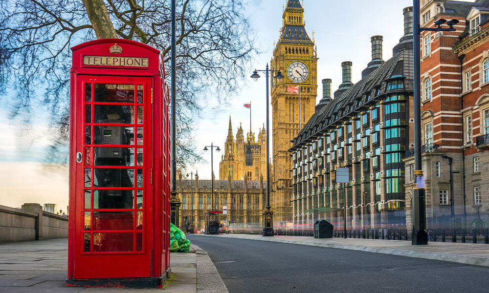 What colour were the UK's red telephone boxes originally intended to be?